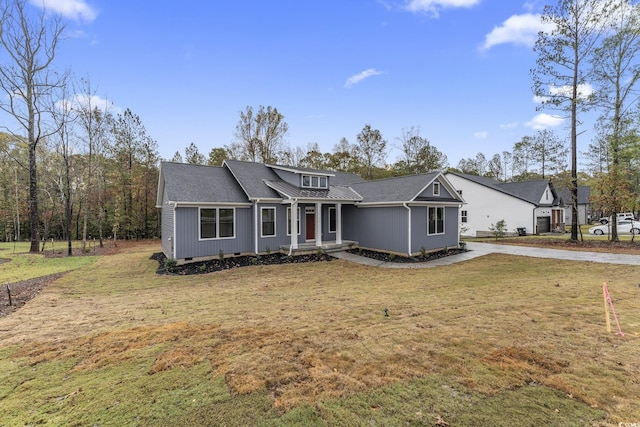 view of front of property with a front lawn and crawl space