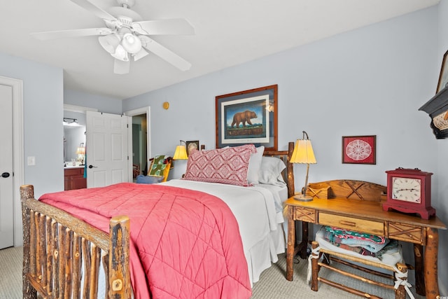 carpeted bedroom with connected bathroom and a ceiling fan