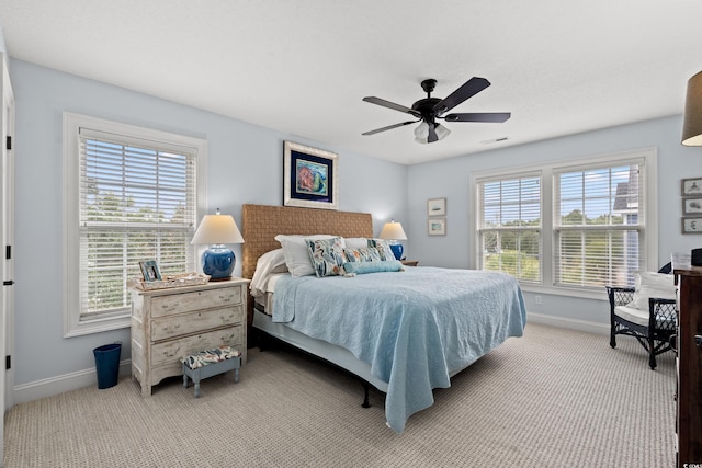 bedroom featuring baseboards, multiple windows, carpet floors, and visible vents