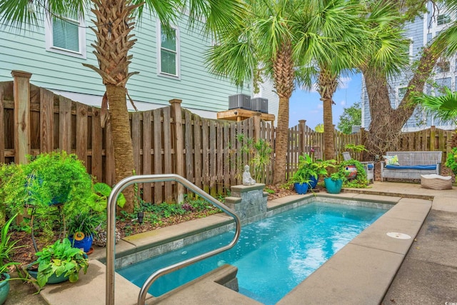 view of swimming pool with a fenced backyard