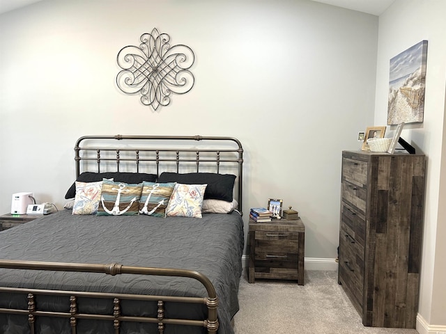 bedroom featuring baseboards and carpet floors