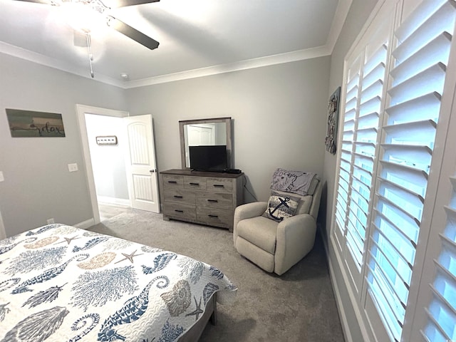 bedroom with baseboards, a ceiling fan, carpet, and ornamental molding