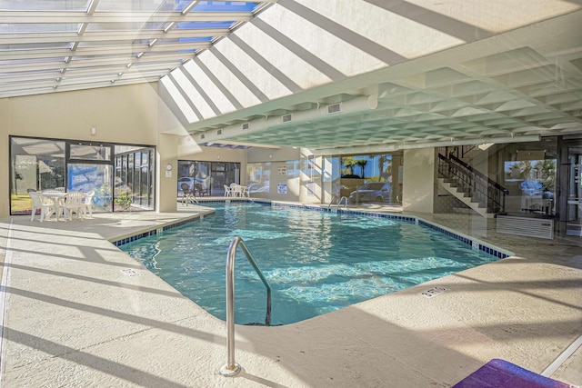 pool featuring a patio area and stairs