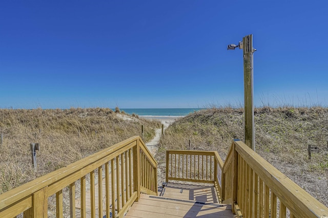 view of community featuring a water view and a view of the beach