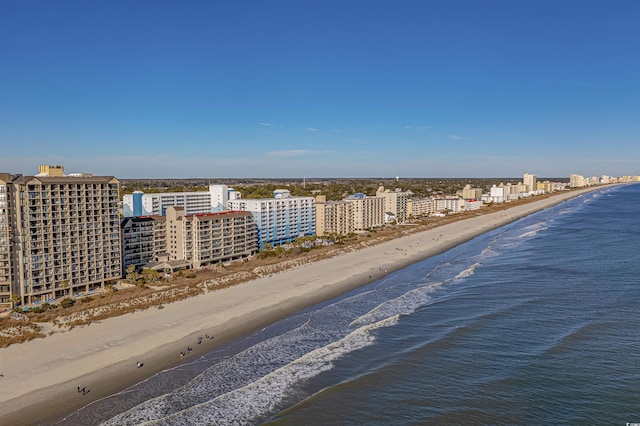 birds eye view of property with a city view, a beach view, and a water view