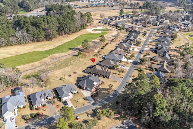 bird's eye view featuring view of golf course and a residential view