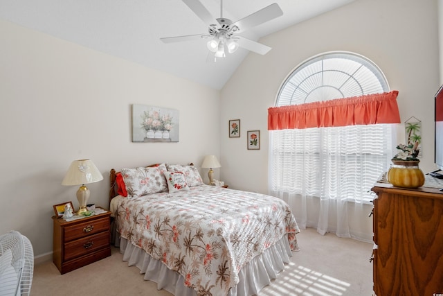 carpeted bedroom featuring lofted ceiling, baseboards, and ceiling fan