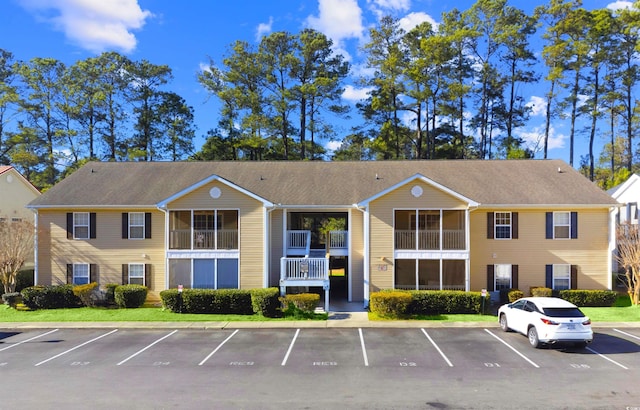 view of property with uncovered parking