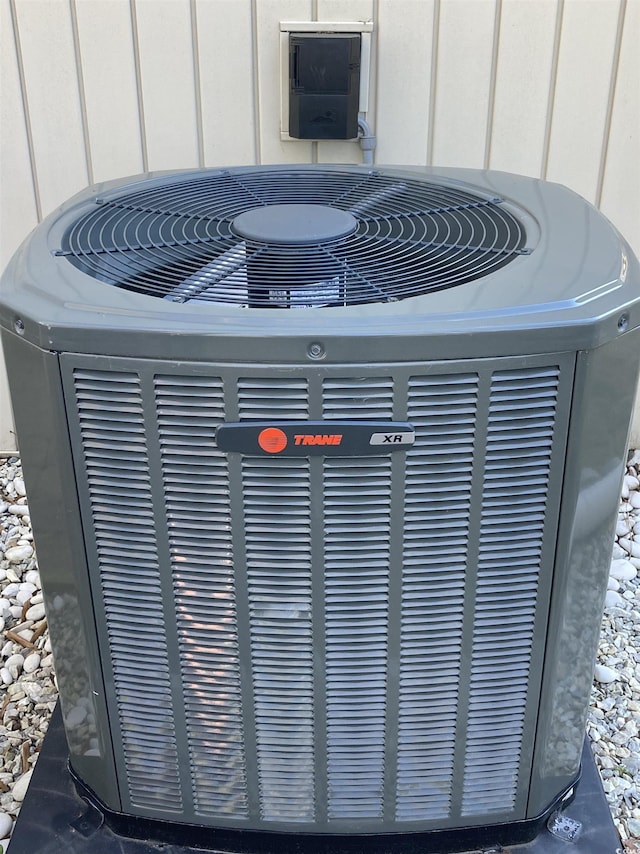 exterior details with central AC unit and board and batten siding