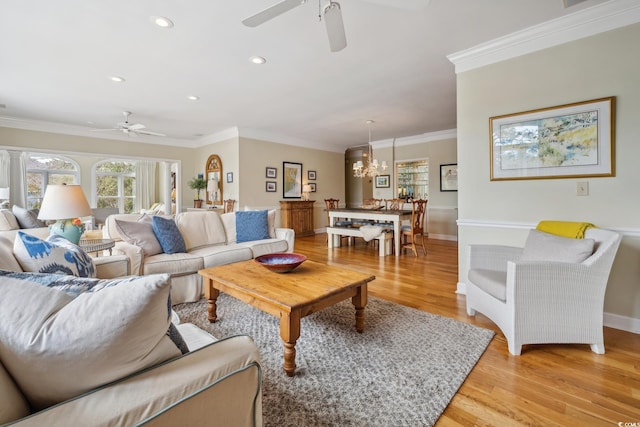 living area with baseboards, recessed lighting, ceiling fan, ornamental molding, and light wood-type flooring