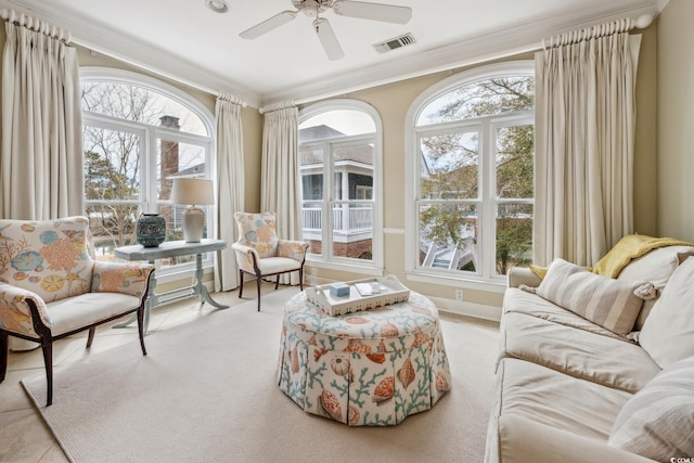 sunroom / solarium featuring visible vents and a ceiling fan