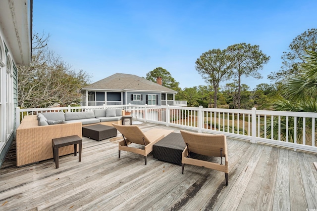 wooden deck with outdoor lounge area