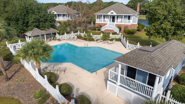 pool with a gazebo, a patio, stairway, and fence