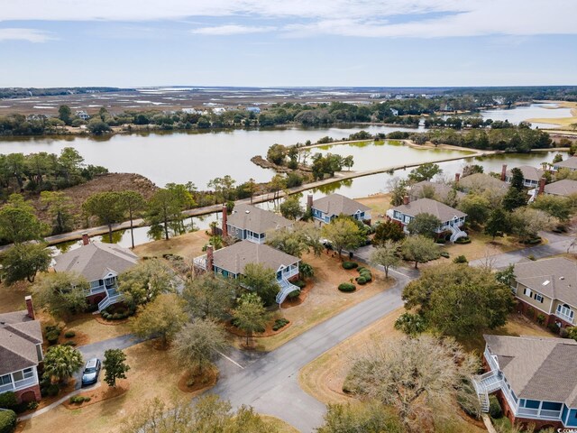 drone / aerial view with a residential view and a water view