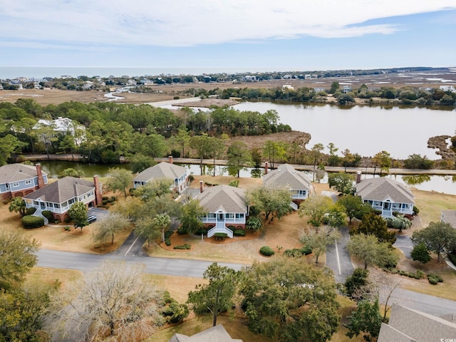 bird's eye view featuring a residential view and a water view