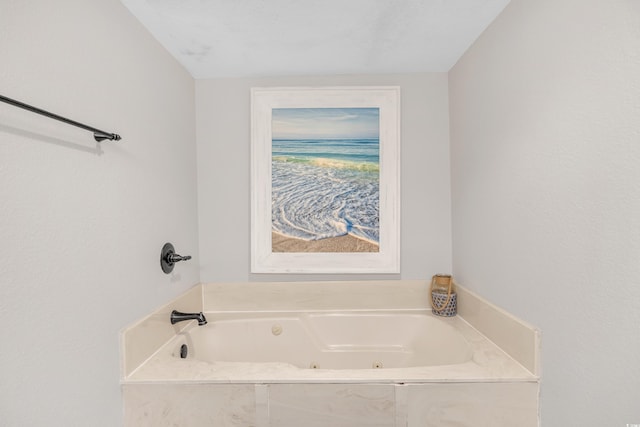 full bathroom featuring a whirlpool tub