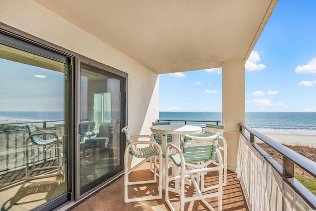 balcony with a view of the beach and a water view