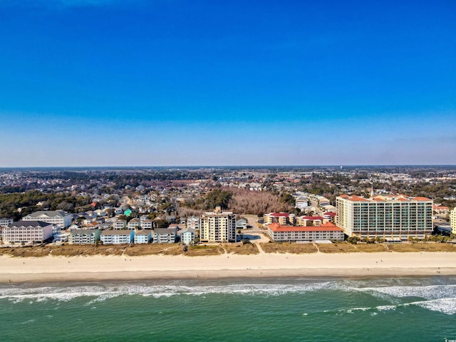 birds eye view of property featuring a city view, a beach view, and a water view