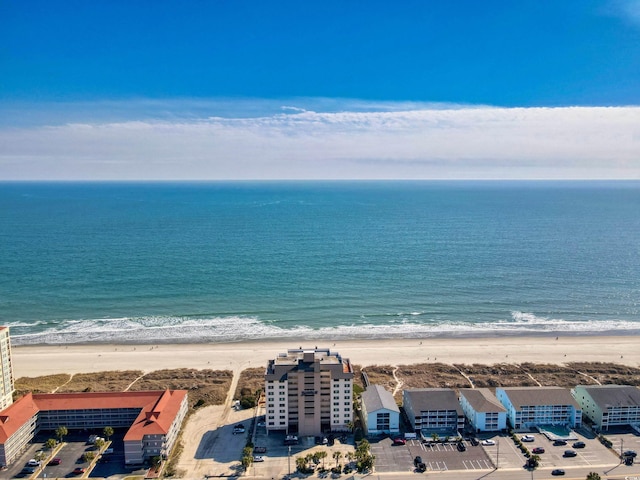 drone / aerial view with a beach view and a water view