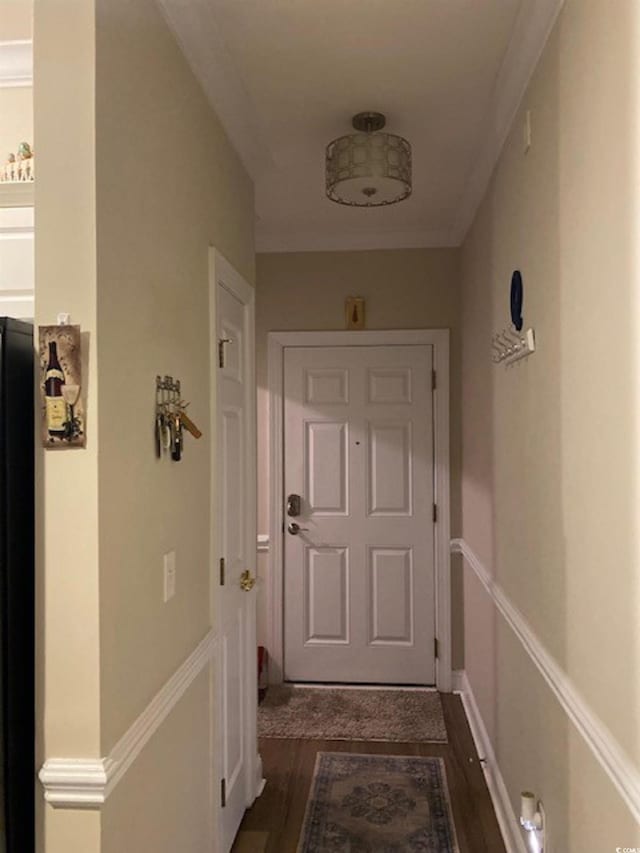 entryway with baseboards, dark wood-style flooring, and crown molding