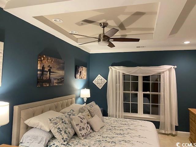 bedroom featuring a ceiling fan, baseboards, recessed lighting, crown molding, and a raised ceiling