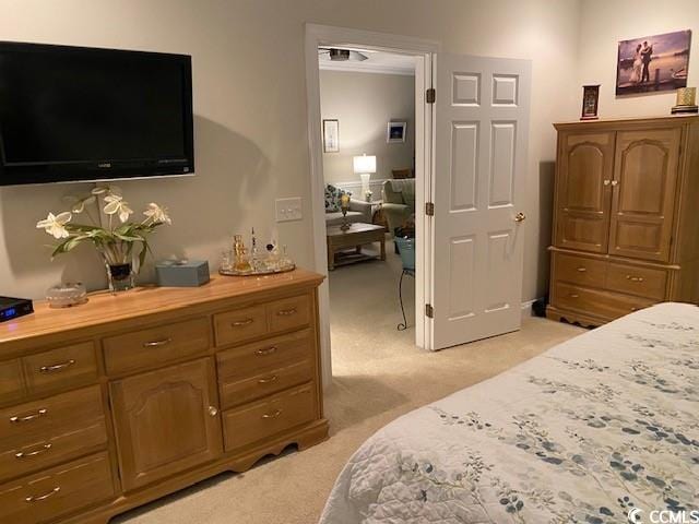 bedroom featuring light carpet