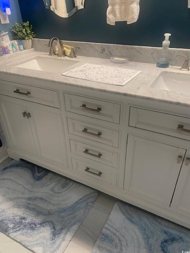 bathroom featuring double vanity and a sink