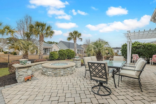 view of patio / terrace featuring outdoor dining space, a pergola, and fence