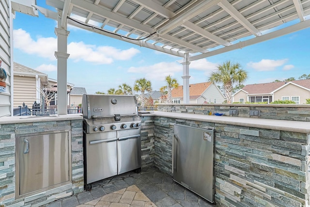 view of patio / terrace with area for grilling, a residential view, and grilling area