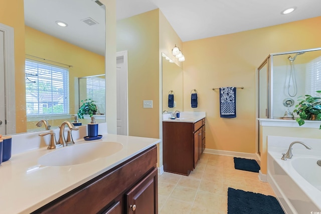 bathroom featuring tile patterned flooring, visible vents, a stall shower, and a sink