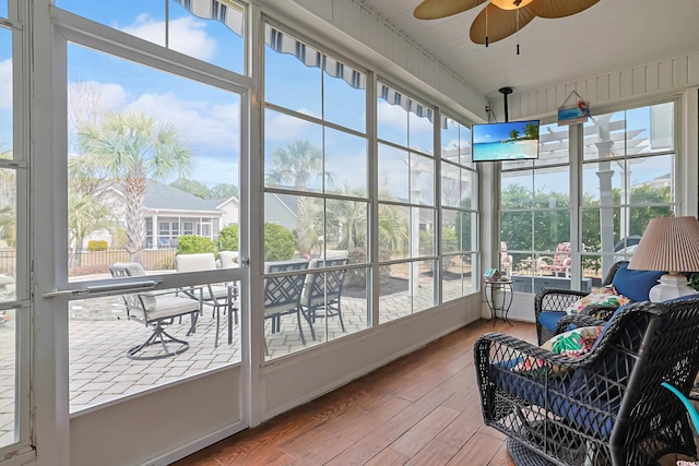 sunroom with a ceiling fan