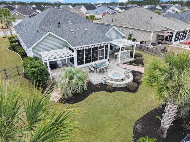 back of property featuring a residential view, roof with shingles, a fenced backyard, and a patio area