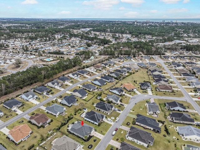 birds eye view of property featuring a residential view and a water view