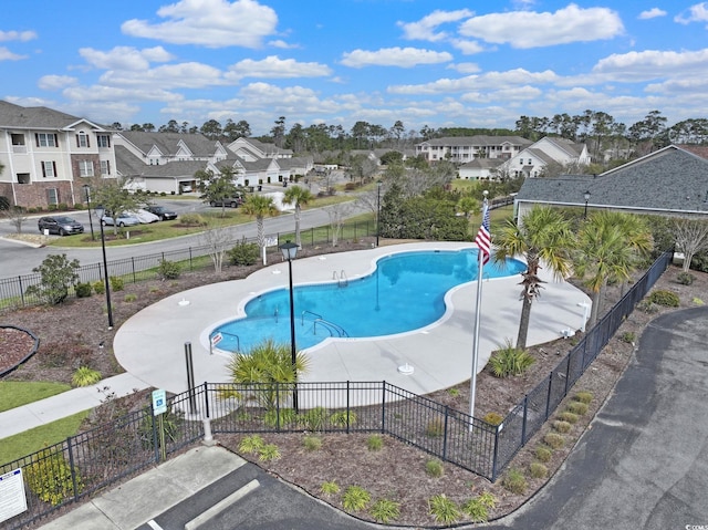 pool featuring a residential view and fence private yard