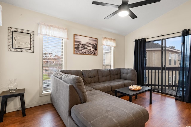 living area with vaulted ceiling, plenty of natural light, and wood finished floors