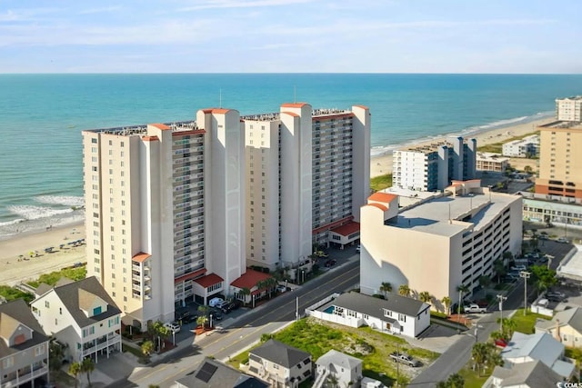 bird's eye view with a view of city, a view of the beach, and a water view