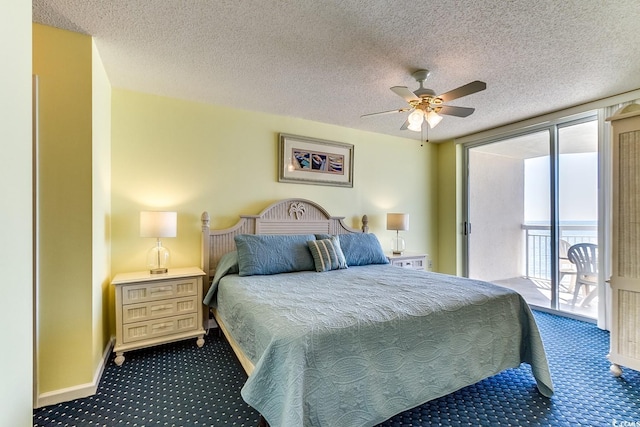 bedroom with dark carpet, a textured ceiling, a ceiling fan, and access to outside