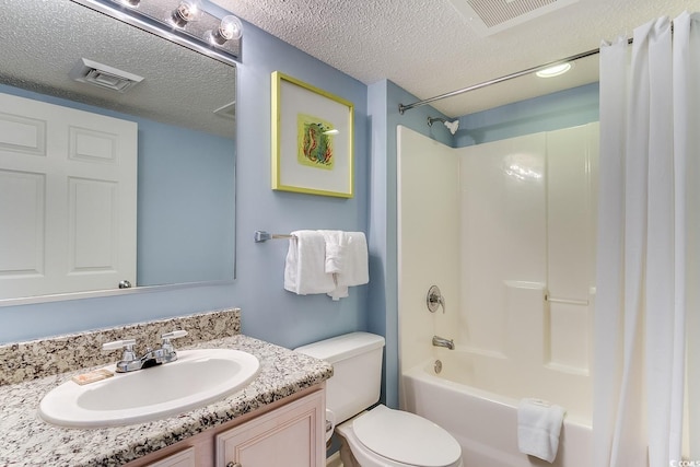 bathroom featuring visible vents, toilet, shower / bath combo, a textured ceiling, and vanity