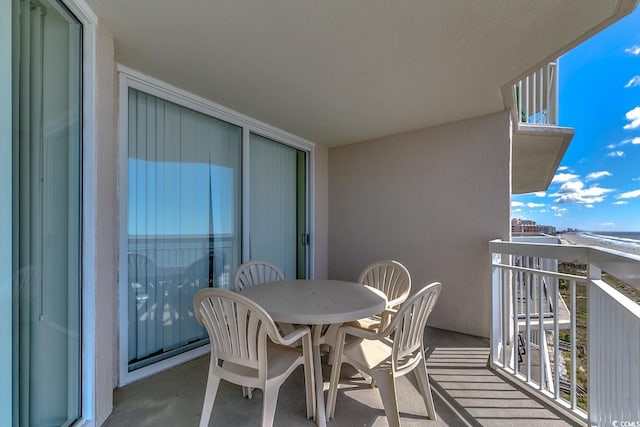 balcony featuring outdoor dining area