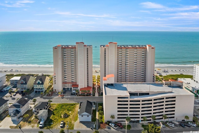 bird's eye view featuring a water view and a view of the beach