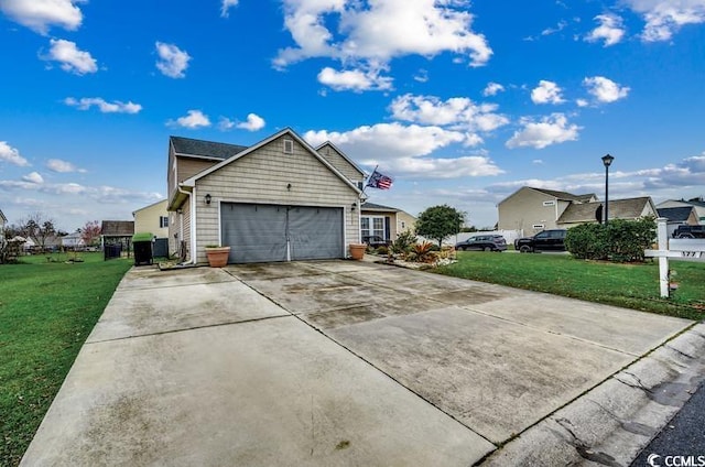 view of home's exterior with a lawn, a garage, and driveway