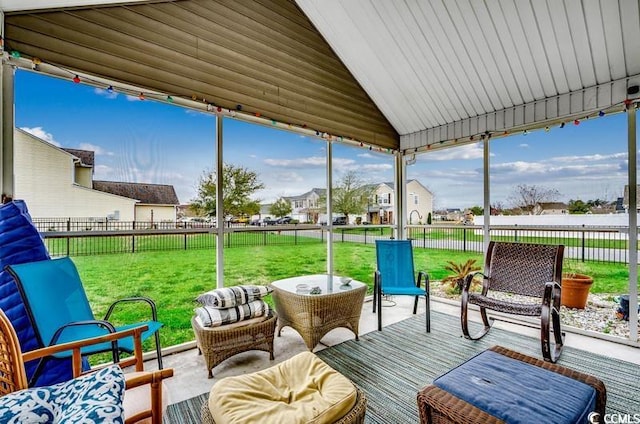 unfurnished sunroom with lofted ceiling