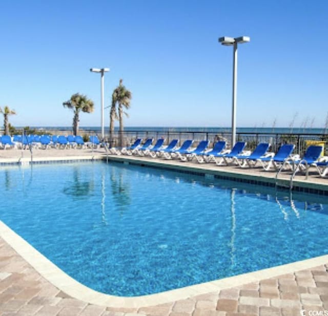 pool featuring a patio area