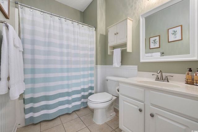 bathroom with vanity, tile patterned floors, toilet, and a shower with curtain