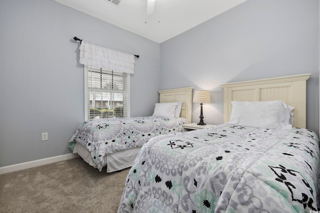 bedroom featuring visible vents, a ceiling fan, baseboards, and carpet floors