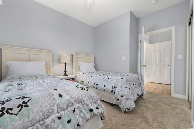 carpeted bedroom with baseboards