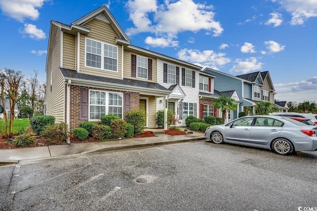 view of front of home with brick siding