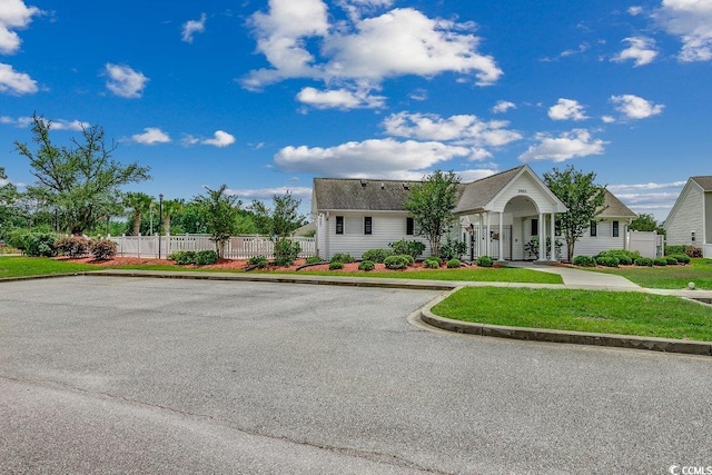 view of front of property featuring fence