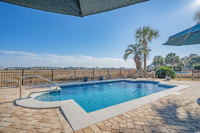 view of pool featuring a patio area, a fenced in pool, and a fenced backyard