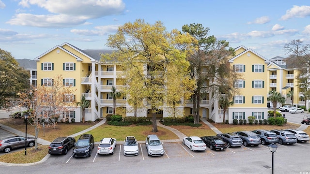 view of property with uncovered parking